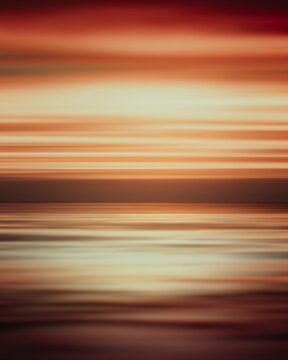 Blurred view of the sea and the sky at sunset with clouds in Vladivostok, Russia.