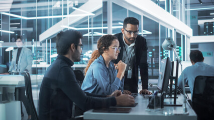 Team of Industrial Design Agency Specialists Discussing a 3D Circuit Board Model Created on a CAD...