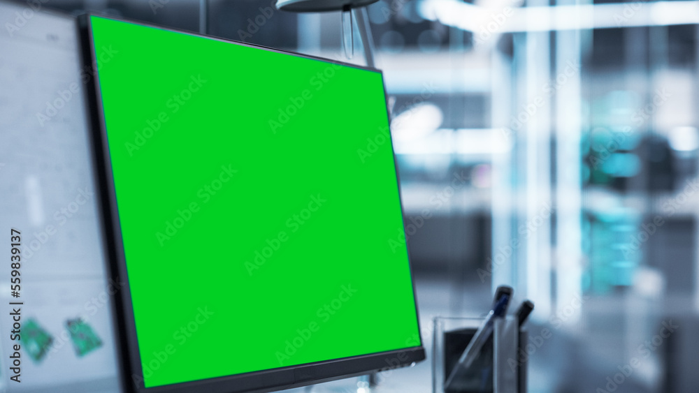 Poster Close Up of a Computer Monitor Display with Green Screen Chromakey Display Screen. Modern Factory Engineer's Office Concept.