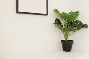 Indoor decorative artificial plant with black pot