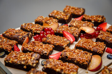 Set of brownies with nuts and salted caramel. Chocolate cake with nuts and caramel.