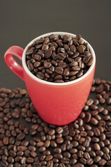 coffee beans in a cup on black background