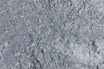 silver rough wrinkle foil texture. aluminum foil texture background. metal plate