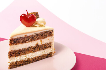 Background of carrot cake with heart candle for Valentine's Day