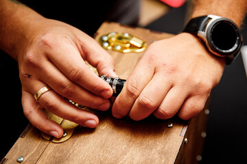 Hands open the combination lock close-up.