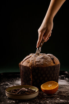 Chef cutting a delicious Panettone, a famous italian christmas cake