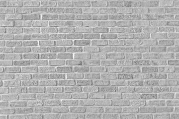 Old grungy retro bright brick wall of ancient city. Uneven clear pitted peeled surface brickwork of cellar worn. Ruined solid bumpy stiff blocks. Hard beautiful brickwall for 3D grunge minimal design