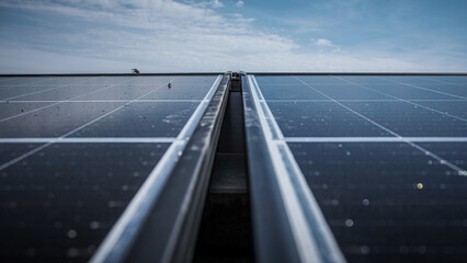 Solar panels being installed on the roof of an industrial company