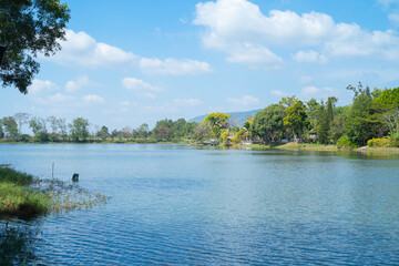 Green mountain hill with lake or river reflection. Nature landscape background, Thailand.