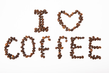 Coffee beans isolated on white background. The inscription I LOVE COFFEE from coffee beans.