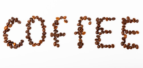 Coffee beans isolated on white background. The inscription COFFEE from coffee beans.