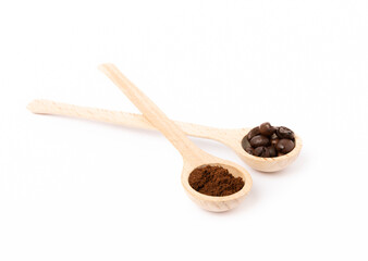 Ground coffee and coffee beans in wooden spoons isolated on white background.