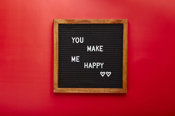 Letter board on red background. Top view. Background for Valentine's day