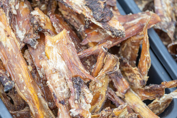 Close up of dried meat for a dog, snack for doggy, animal food concept