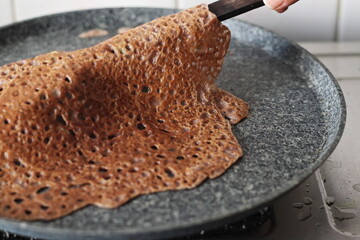 Instant Finger Millet Dosa, made with finger millet flour, curd and spices. Cooked on a saute pan...
