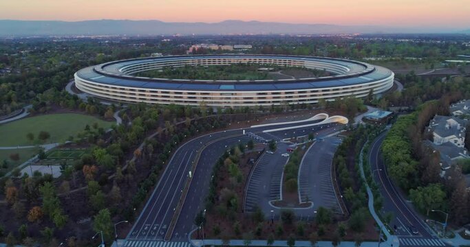 Aerial: Apple Campus spaceship at sunrise in Sunnyvale / Cupertino Silicon Valley, California, USA. 21 April 2022