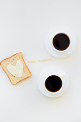 sandwich for breakfast in form of heart with cheese - good morning sign and two coffee cups