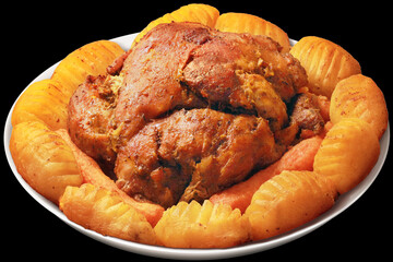 Oven Baked Pork Shoulder with Swedish Hasselback Potatoes Served on Round Ceramic Platter Isolated on Black Background