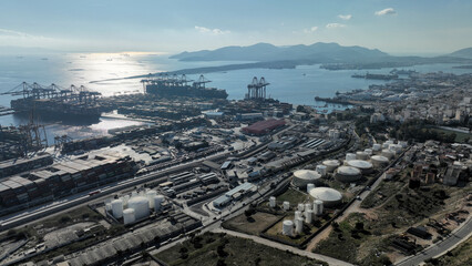 Aerial drone photo of industrial container logistics unloading import and export container terminal of Perama - Piraeus, Attica, Greece