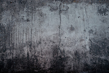 Obraz premium Dark grey wall with a crack, surface. Background