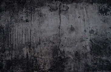 Dark grey wall with a crack. Texture, background
