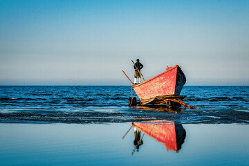 Fisherman looking from the Boat on the Beach - Mazandaran, Iran