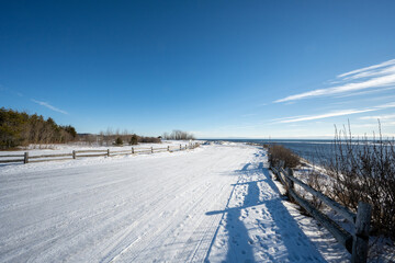 Fototapeta na wymiar Snowy road on the North Shore of the St. Lawrence River.
