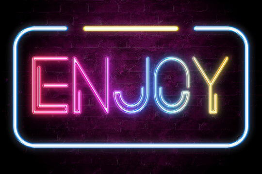 enjoy text on the brick wall in realistic color neon glow