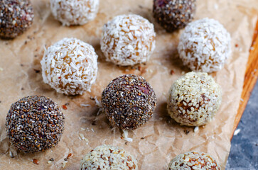 Assorted Vegan Sweets, Delicious Candy Balls with seeds, dried fruit, nuts, and cocoa powder, Healthy Candies