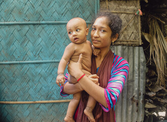 South asian little kid enjoying with his aunt , young girl holding her nephew in arm 