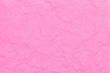 The texture of crumpled pink paper. Flat lay