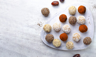 Assorted vegan sweets, Delicious Candy Balls with seeds, dried fruit and cocoa powder, Healthy Candies