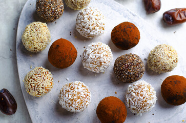 Assorted vegan sweets, Delicious Candy Balls with seeds, dried fruit and cocoa powder, Healthy Candies