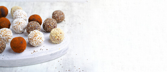 Assorted vegan sweets, Delicious Candy Balls with seeds, dried fruit and cocoa powder, Healthy Candies