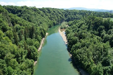 Fototapeta na wymiar river flows down the forest