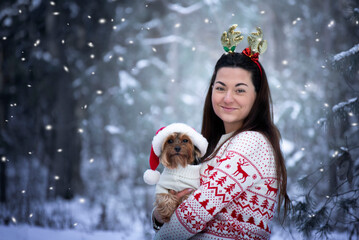  Winter portrait of a girl with her best friend - a dog. The best friendship is between a human and a dog. 