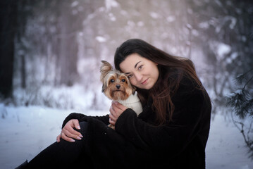  Winter portrait of a girl with her best friend - a dog. The best friendship is between a human and a dog. 