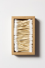 Cardboard box filled with bamboo ear sticks