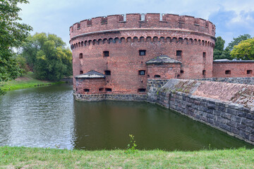 ancient round watchtower and fortress walls of the fortress in the Russian city of Kaliningrad