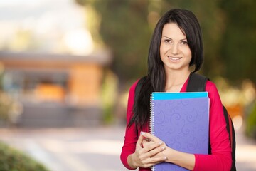 Fototapeta premium young student with backpack outside of school