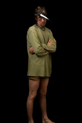 Slim man in army green boxer shorts and with head lamp
