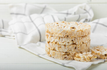 Stack of crispy rice cakes on white texture wood. Diet bread. Diet. proper nutrition. GLUTEN FREE. Copy space. Place for text.