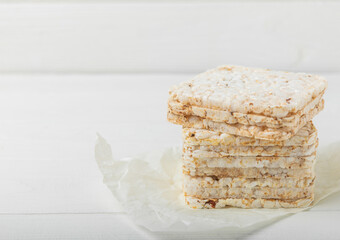 Stack of crispy rice cakes on white texture wood. Diet bread. Diet. proper nutrition. GLUTEN FREE. Copy space. Place for text.