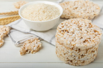 Stack of crispy rice cakes on white texture wood. Diet bread. Diet. proper nutrition. GLUTEN FREE. Copy space. Place for text.