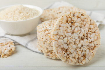 Stack of crispy rice cakes on white texture wood. Diet bread. Diet. proper nutrition. GLUTEN FREE. Copy space. Place for text.