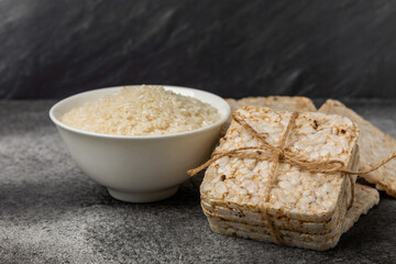 Stack of crispy rice cakes on black textured background. Diet bread. Diet. proper nutrition. GLUTEN FREE. Copy space. Place for text.