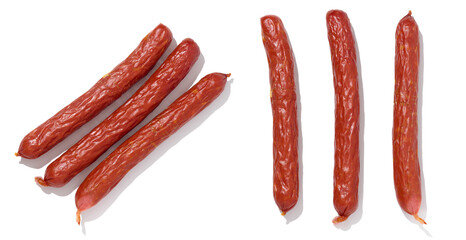 Small smoked sausages on a white isolated background, top view