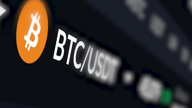 Bitcoin&rsquo;s acronym and logo are shown on a computer screen