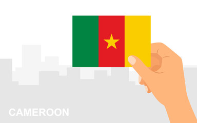 Hand holding the flag of Cameroon on the background of the city in minimal flat style. Vector illustration