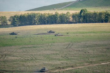 a squadron of British army FV4034 Challenger ii 2 battle tanks on a military combat exercise,...